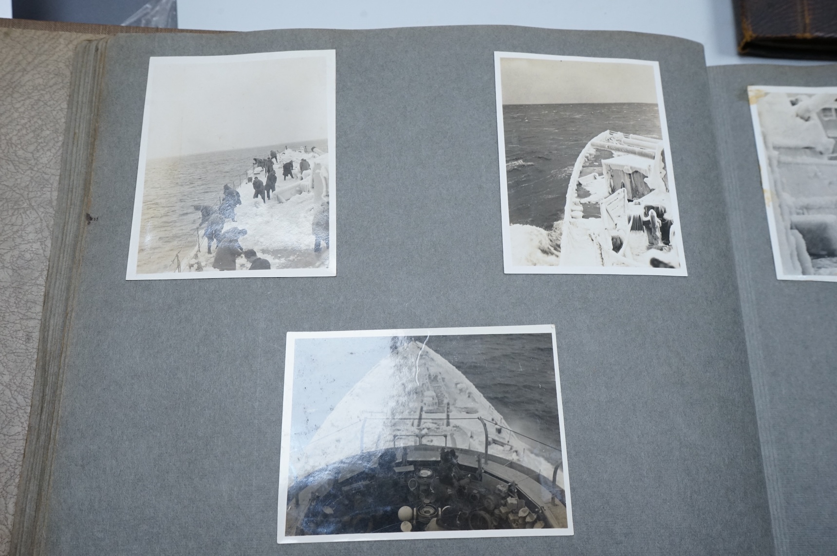 Two WWII naval photo albums, containing an archive of 1940s photographs of the Russian convoy in the Barents Sea, a ship’s concert at Scarpa Flow, a variety of Royal Naval vessels and some aircraft, images aboard HMS Peg